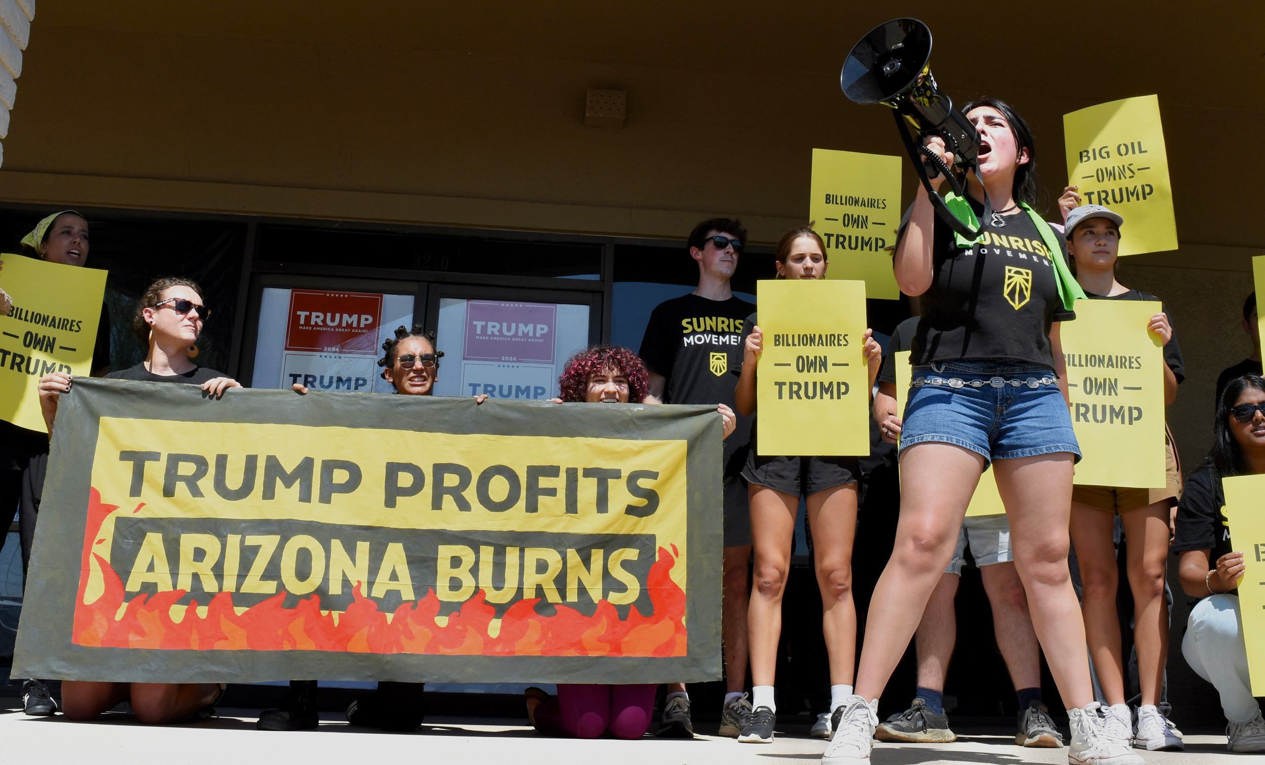 Young activists with the Sunrise Movement gather for a protest outside of former President Donald Trump’s Phoenix campaign office on Sunday. Credit: Adah Crandall/Sunrise Movement