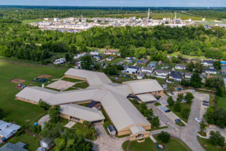 An aerial view of the Fifth Ward Elementary School in Reserve, Louisiana, with the nation’s only chloroprene plant in the background. Credit: Lee Hedgepeth/Inside Climate News