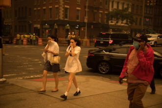 Pedestrians cover their faces as smoke from wildfires in Canada has trigger air quality alerts in New York City on June 7, 2023. Credit: Michael Nagle/Xinhua via Getty Images