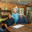Clara Riley stands among her relatives and neighbors in her Oak Grove home. Credit: Lee Hedgepeth/Inside Climate News