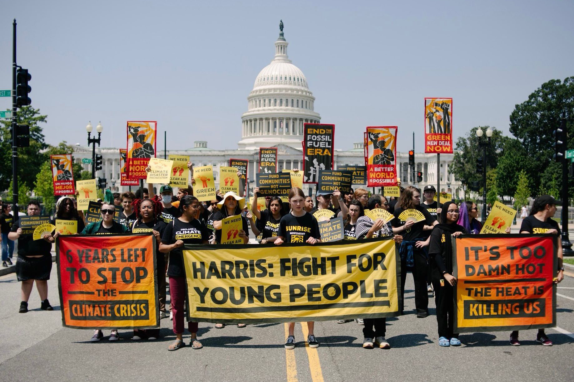 Sunrise Movement activists march to the Democratic National Committee’s office to urge Kamala Harris to make bold climate policy central to her campaign on July 29. Credit: Rachael Warriner/Sunrise Movement